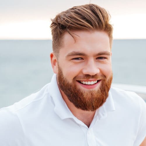 Man showing off his same day dental crown